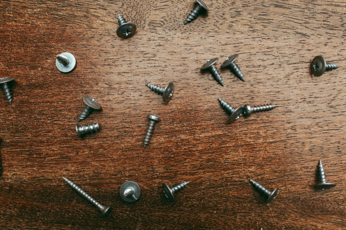 Close up of a screw being driven into wood
