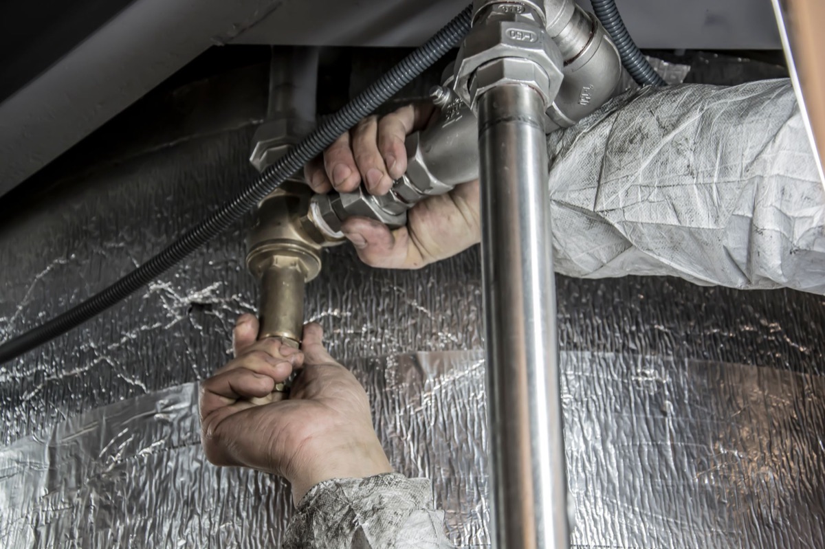plunger and refrigerator pipe in kitchen